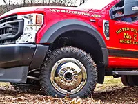 Red brush truck with dually Founders tires