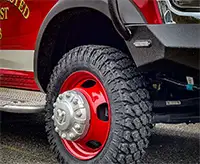 Close-up of red wheel and Founders tires