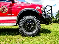 Red fire apparatus with large Founders tires