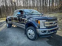 Camo-wrapped off-road truck with Founders tires