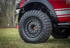 Close-up of aggressive Founders tires tread
